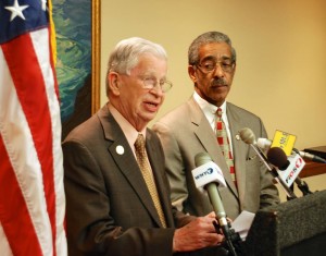 Thompson (left) calls for an investigation while Rice listens at Thursday's press conference