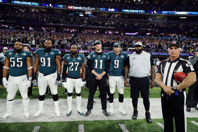 MINNEAPOLIS, MN - FEBRUARY 04: Brandon Graham #55, Fletcher Cox #91, Malcolm Jenkins #27, Carson Wentz #11 and Nick Foles #9 of the Philadelphia Eagles stand for the national anthem prior to Super Bowl LII against the New England Patriots at U.S. Bank Stadium on February 4, 2018 in Minneapolis, Minnesota. (Photo by Elsa/Getty Images)